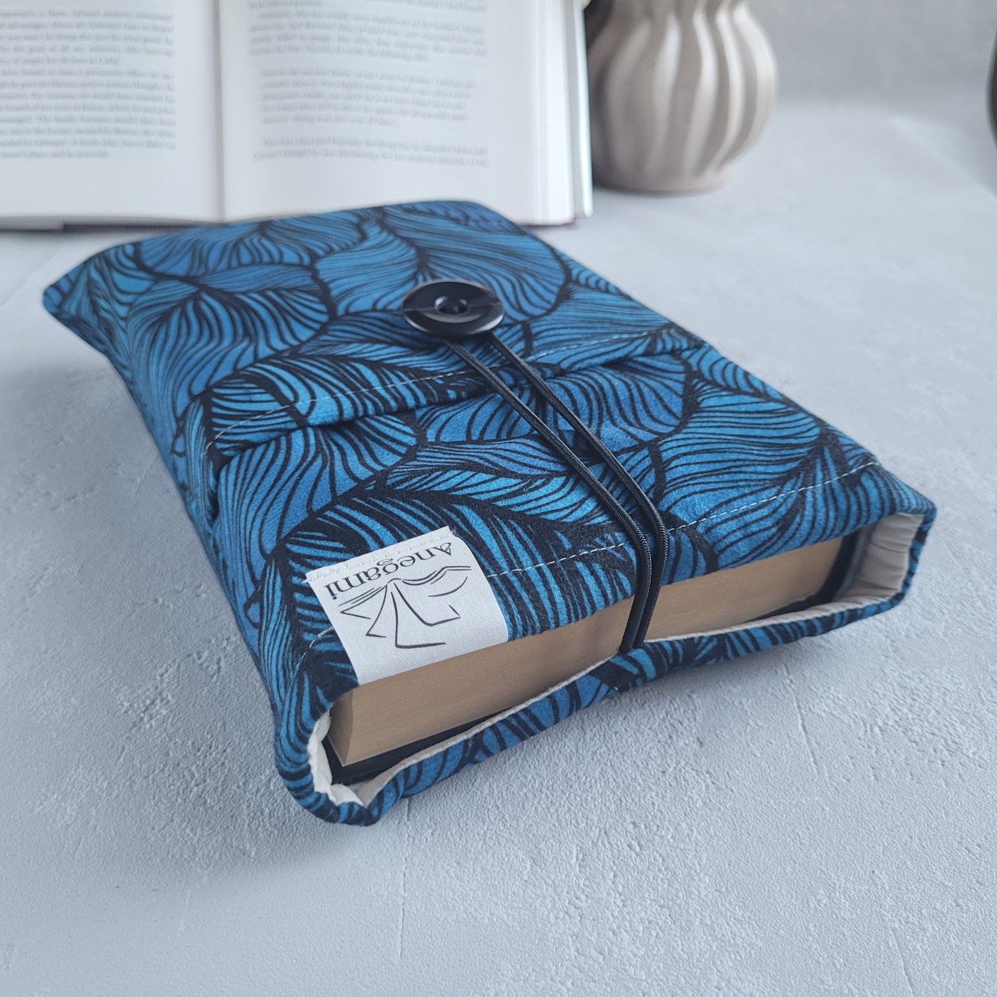 Blue fabric book sleeve with pocket