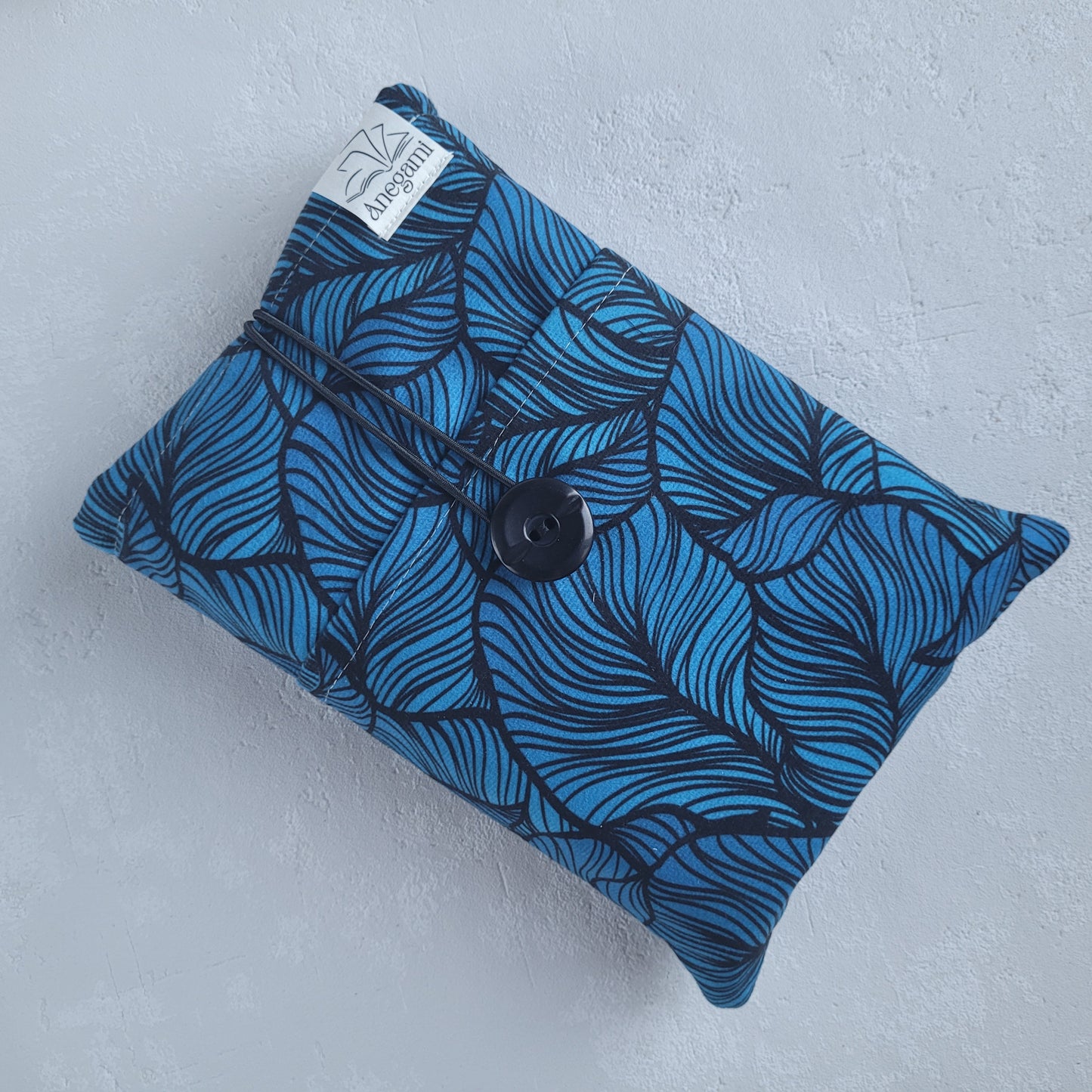 Blue fabric book sleeve with pocket