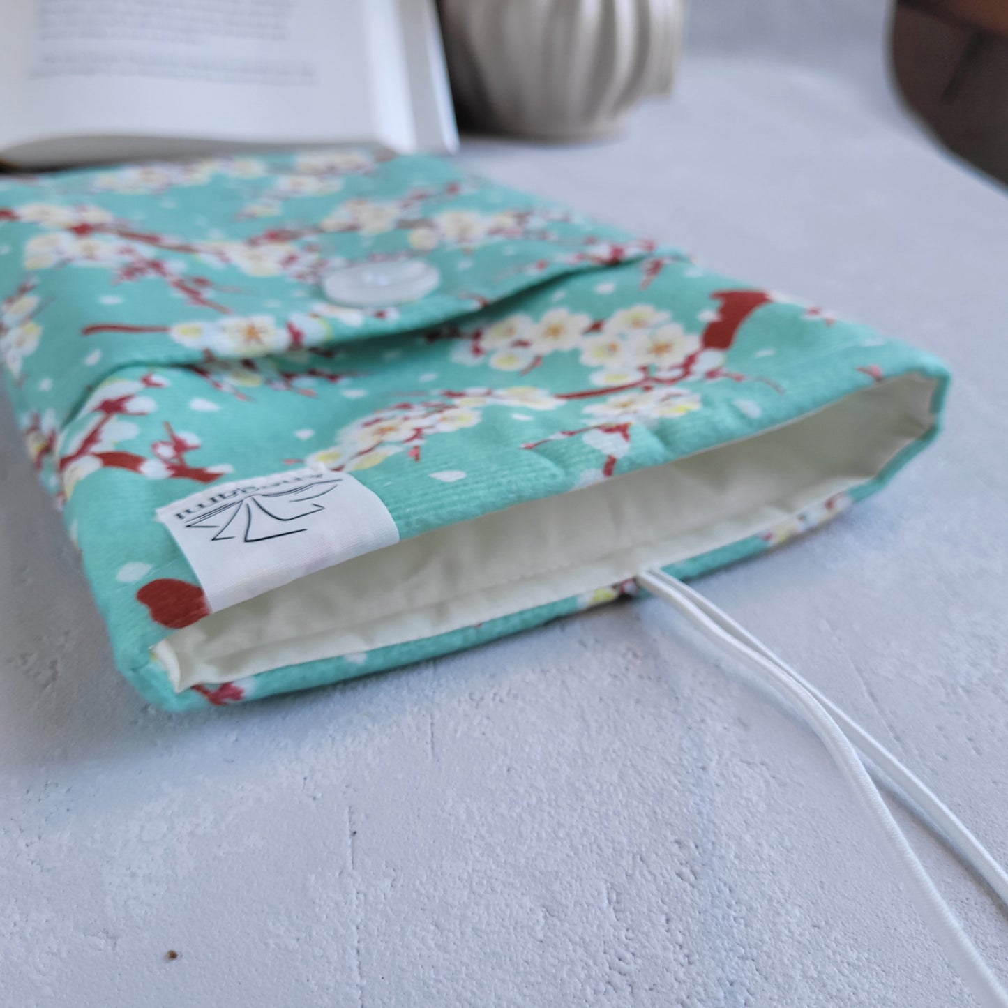 Green Cherry Blossom fabric book sleeve with pocket